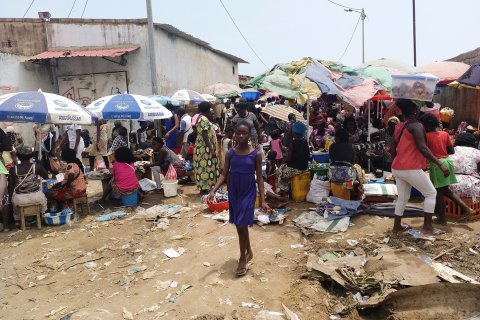 DANIEL GARELO PENSADOR: A young girl walks through the Buracos market, in the Angolan restive region of Cabinda, on April 9, 2019 in Cabinda, Angola. - Since he came to power in 2017, Angolan President Joao Lourenco has promoted himself as transparent, moderate leader who is kee