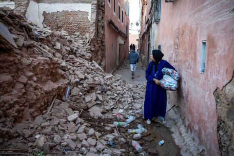 FADEL SENNA: A woman looks at the rubble of a building in the earthquake-damaged old city in Marrakesh on September 9, 2023. A powerful earthquake that shook Morocco late September 8 killed more than 600 people, interior ministry figures showed, sending terrified resi