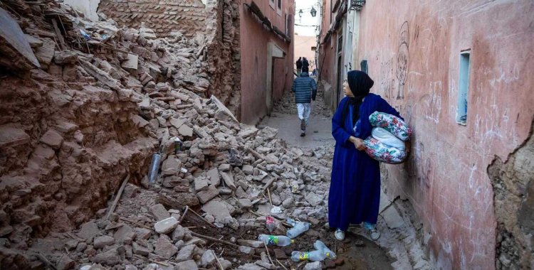 FADEL SENNA: A woman looks at the rubble of a building in the earthquake-damaged old city in Marrakesh on September 9, 2023. A powerful earthquake that shook Morocco late September 8 killed more than 600 people, interior ministry figures showed, sending terrified resi